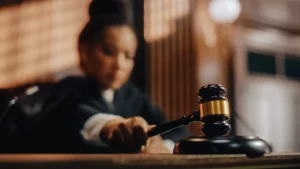 A judge with a gavel in her hand.